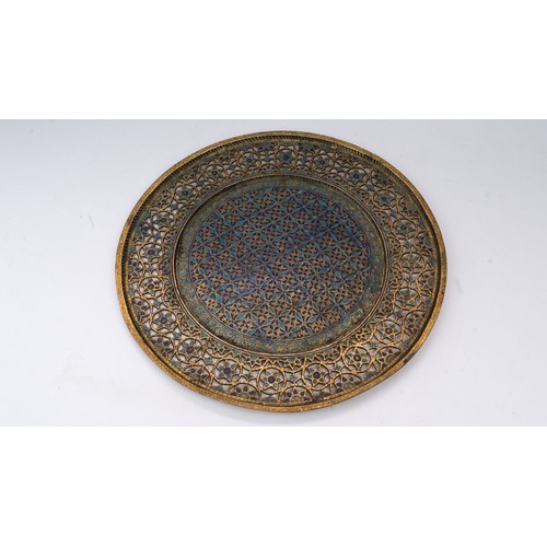 105 - AN OTTOMAN GILTED TRAY, TOMBAK, KUTAHYA,  EARLY 19TH CENTURY

Of circular form, the central field an... 