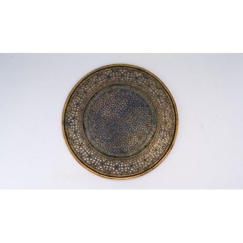 105 - AN OTTOMAN GILTED TRAY, TOMBAK, KUTAHYA,  EARLY 19TH CENTURY

Of circular form, the central field an... 