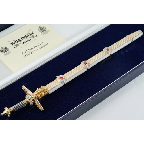 102 - A WILKINSON  GOLDEN JUBILEE MINIATURE SWORD

A Wilkinson Sword Golden Jubilee Miniature Sword

An or... 