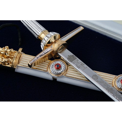 101 - A PAIR OF  Wilkinson Sword Golden Jubilee Miniature Sword

 Ornate cross hilted sword to commemorate... 