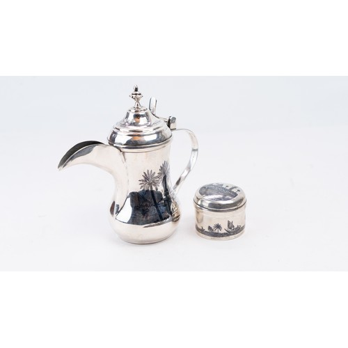 83 - A MID-20TH CENTURY IRAQI SILVER DALLAH COFFEE POT, OMARA OR BASRA, CIRCA 1950.   AN EARLY 20TH CENTU... 