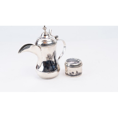 83 - A MID-20TH CENTURY IRAQI SILVER DALLAH COFFEE POT, OMARA OR BASRA, CIRCA 1950.   AN EARLY 20TH CENTU... 