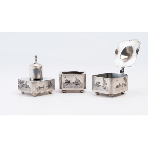 82 - AN EARLY 20TH CENTURY IRAQI SILVER AND NIELLO THREE-PIECE CRUET SET, OMARA, CIRCA 1930
SIGNED GHAREE... 