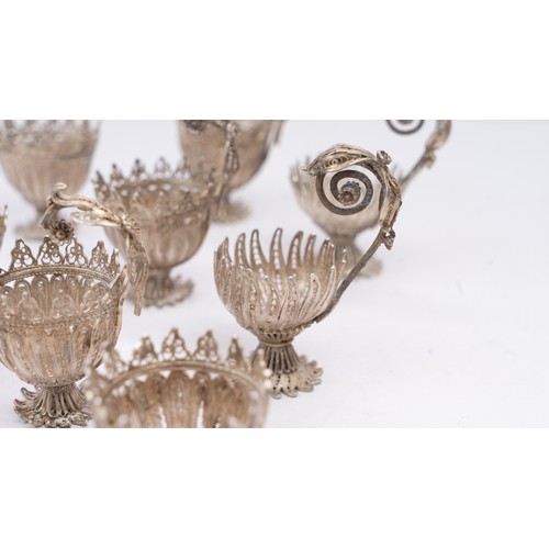 78 - A SET OF NINE SILVER TELKARI ZARF, SALT CELLARS

Each crafted in the form of a blossoming flower, th... 