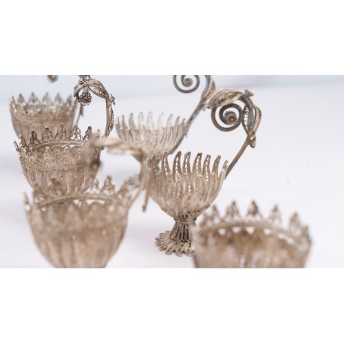 78 - A SET OF NINE SILVER TELKARI ZARF, SALT CELLARS

Each crafted in the form of a blossoming flower, th... 