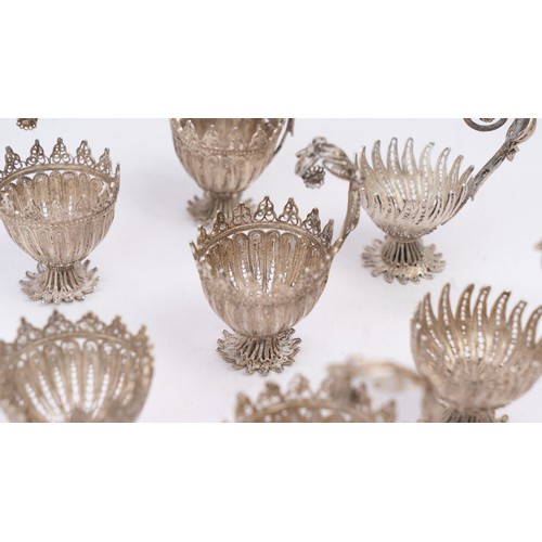 78 - A SET OF NINE SILVER TELKARI ZARF, SALT CELLARS

Each crafted in the form of a blossoming flower, th... 