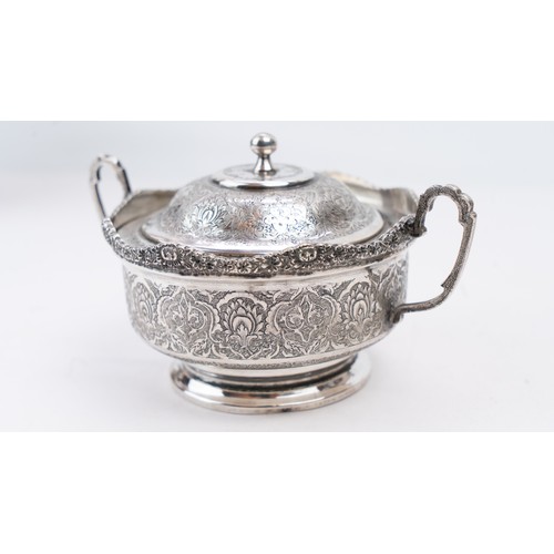 69 - PERSIAN SILVER SUGAR BOWL ISFAHAN, CIRCA 1930 PAHLAVI PERIOD
The  scalloped rim on four cast foliate... 