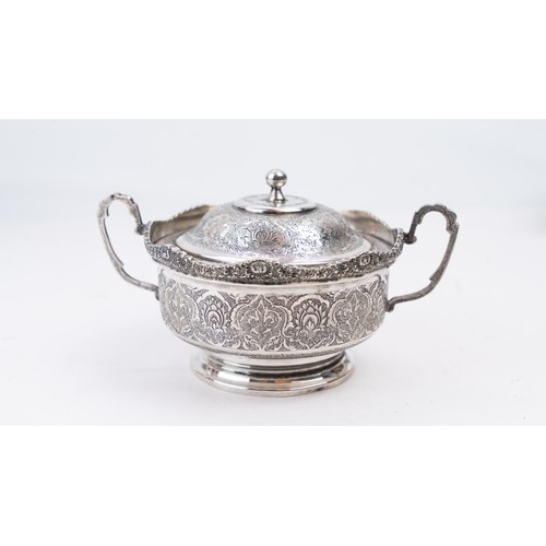 69 - PERSIAN SILVER SUGAR BOWL ISFAHAN, CIRCA 1930 PAHLAVI PERIOD
The  scalloped rim on four cast foliate... 