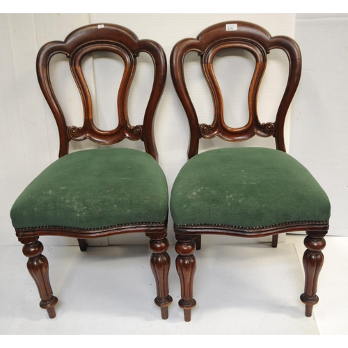 215 - Pair of Victorian mahogany spoon-backed upholstered chairs on turned and reeded legs