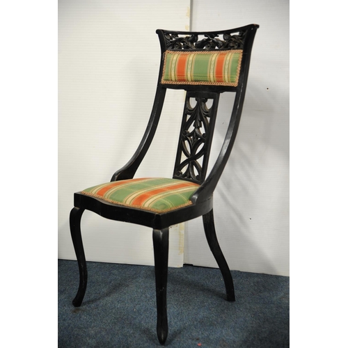 217 - Ebonised upholstered easy chair on cabriole legs