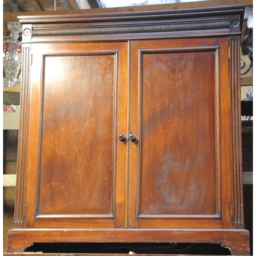 229 - Two door mahogany press fitted with shelves on bracket feet (43