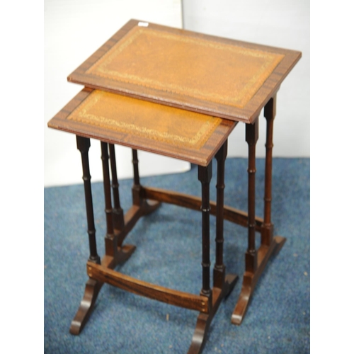 232 - Nest of two leather embossed tables (21