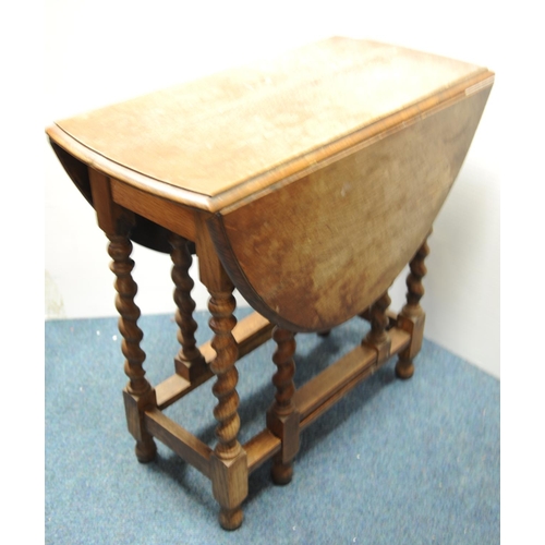 235 - Oak drop-leaf table on barley-twists supports (42