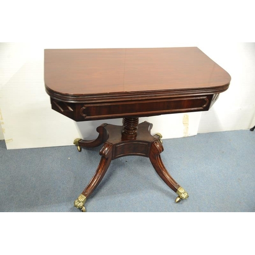 118 - Regency Mahogany Fold Over Tea Table with baluster pod on four splayed legs with  brass castors.