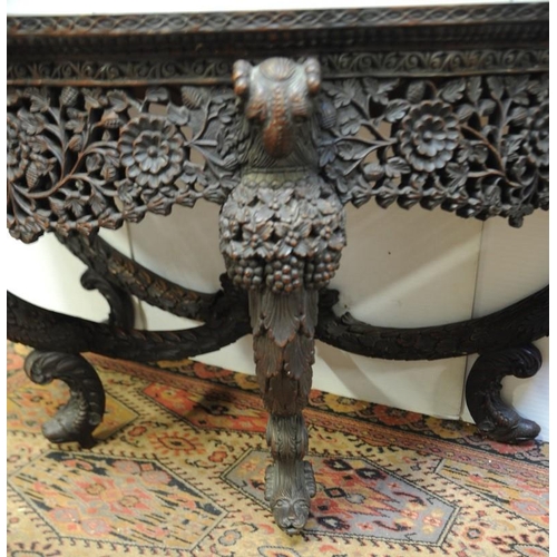 165 - Rosewood 19th. Century Anglo Indian  Console Table with profusely carved frieze surmounted by  Ram's... 