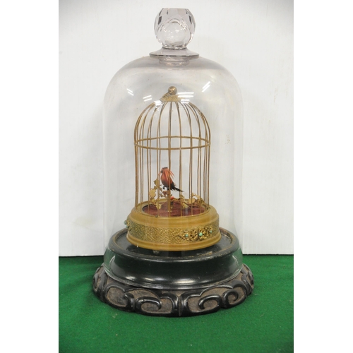 228 - Miniature Mechanical Bird in Cage under glass dome on base (17