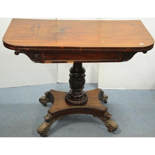 233 - Regency Mahogany Fold Over Tea Table on baluster pod and 4 splayed carved legs.