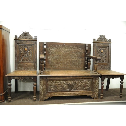 75 - Victorian carved oak Monk's Bench with a pair of carved oak high backed matching Hall Chairs