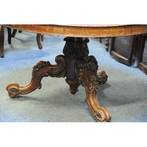 216 - Circular Rosewood Dining Table on carved baluster pod on three splayed legs.                  (52