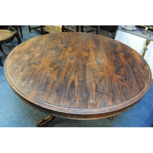 216 - Circular Rosewood Dining Table on carved baluster pod on three splayed legs.                  (52