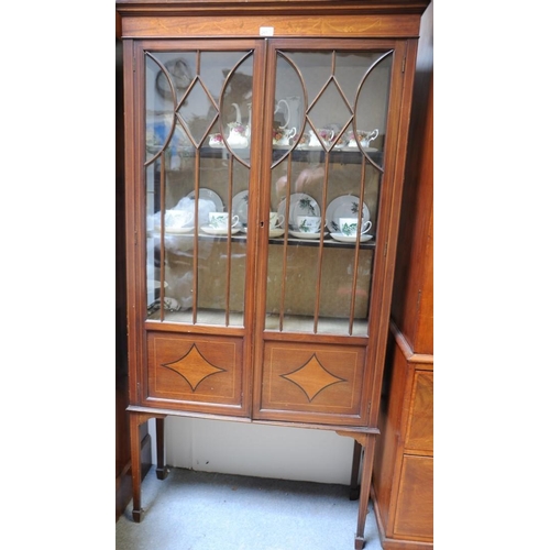 277 - Edwardian inlaid Mahogany two door glazed Display Cabinet on tapered legs.                     (34