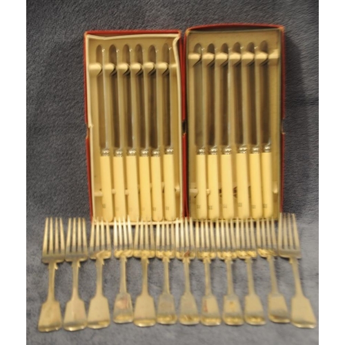 282 - 12 Bone Handled Large Dinner Knives and 12 Large Dinner Forks.