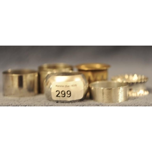 299 - 2 Silver Napkin Rings  (Birmingham 1906) and 4 silver plated Napkin Rings.