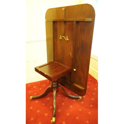 262 - Regency Mahogany Breakfast Table on four splayed legs with brass castors.