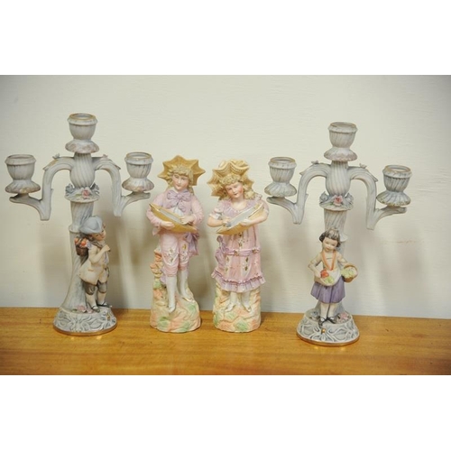 43 - Pair of China Figures of Boy and Girl and a pair of three branch China Candelabras.