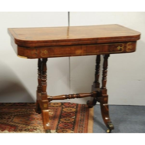 99 - Regency Mahogany brass inlaid Fold Over Card Table on turned uprights with cross stretcher on four s... 