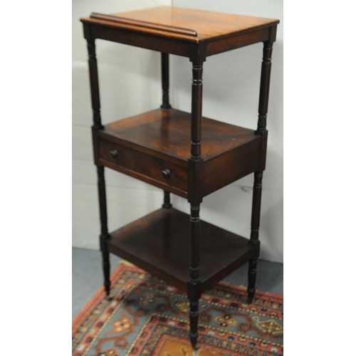 89 - Georgian Mahogany three tier Dumbwaiter fitted with one pull out drawer on turned uprights.