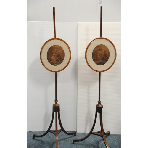 95 - Pair of Georgian inlaid Mahogany oval shaped Pole Screens on 3 splayed legs.