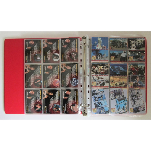 247 - JAMES BOND TRADING CARDS a large quantity to include 2 collector folders, one other folder and many ... 