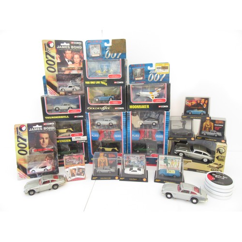 311 - Various James Bond Models to include Motorised Aston Martin D.B.7 Mint in good boxes. (22)