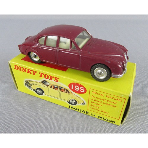 255 - DINKY TOYS 195 Jaguar 3.4 Saloon in Maroon. Near Mint in a Near Mint Box.