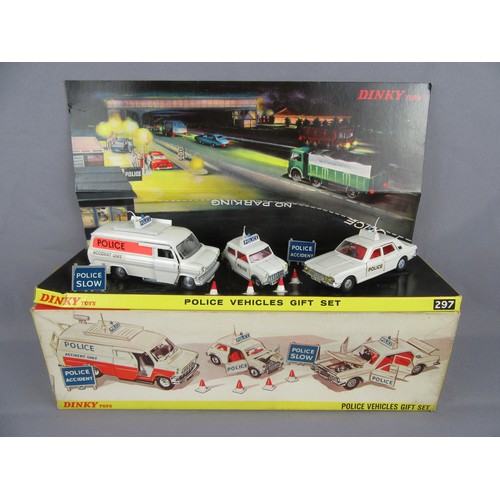 DINKY TOYS 297 Police Vehicles Gift Set. Appears complete with accessories. Vehicles are Excellent on a Good Plus inner stand, outer Box is Excellent.