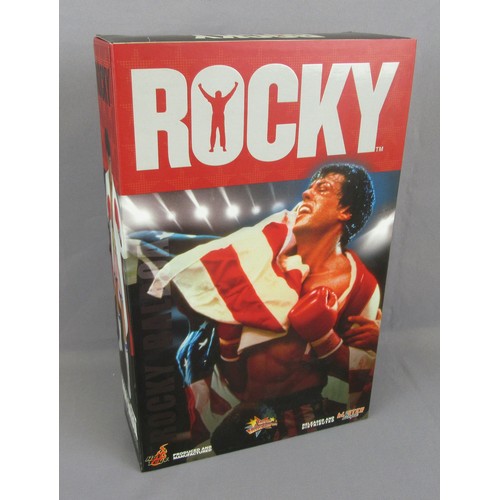 128 - HOT TOYS MMS19 ROCKY BALBOA 12’’ action figure. Mint in a Very Near Mint Box plus embroidered beanie... 