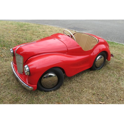 200 - AUSTIN J40 PEDAL CAR – Restored to an excellent standard in red with tan upholstery, plus accessorie... 