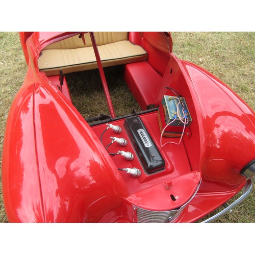 200 - AUSTIN J40 PEDAL CAR – Restored to an excellent standard in red with tan upholstery, plus accessorie... 