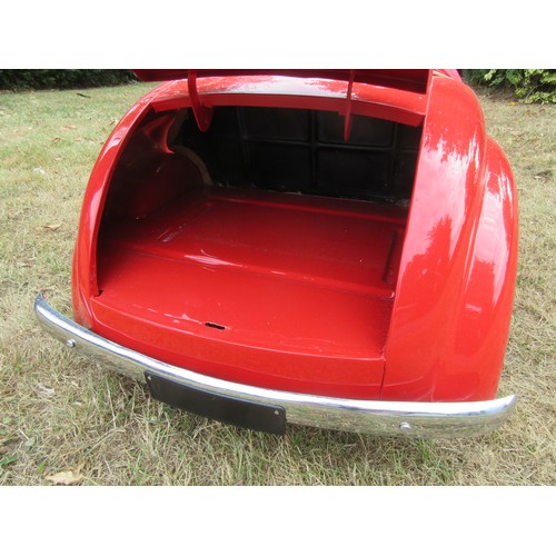 200 - AUSTIN J40 PEDAL CAR – Restored to an excellent standard in red with tan upholstery, plus accessorie... 