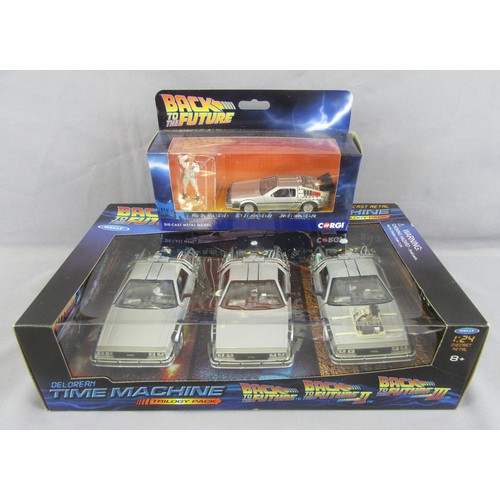 134 - WELLY TOYS 1/24th ‘Back to the Future’ Trilogy set plus Corgi CC05503 Deloren & Figure. Mint in a Ne... 