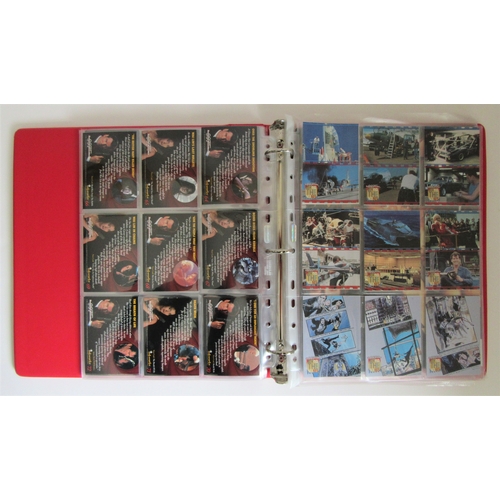 551 - JAMES BOND TRADING CARDS a large quantity to include 2 collector folders, one other folder and many ... 