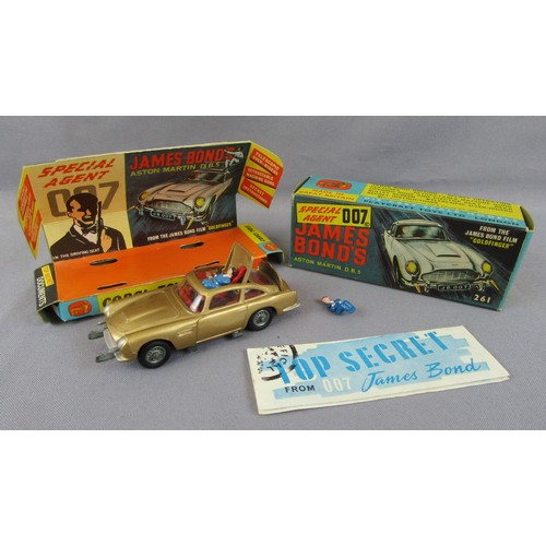 125 - CORGI TOYS 261 James Bond Aston Martin DB5 in gold, with secret instructions, spare bandit figure an... 