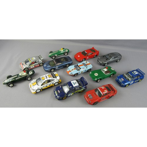 129 - SCALEXTRIC group to include 12 cars (2 are SCX), box of track and numerous accessories. Fair to Exce... 