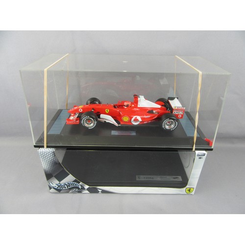 1 - HOT WHEELS 1:18 Formula 1, Ferrari F2004, Michael Schumacher 2004 World Champion on special plinth f... 