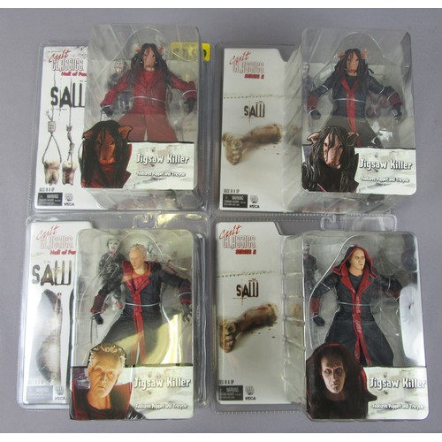 57 - NECA CULT CLASSICS ‘SAW’ 4x Jigsaw Killer figures (2x Hall of Fame, 2x Series 5). Unopened Near Mint... 