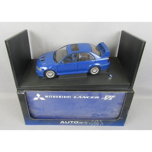 74 - AUTOART 1:18 Mitsubishi Lancer Evo VI Street version in blue. Excellent to Near Mint (dirty from dis... 