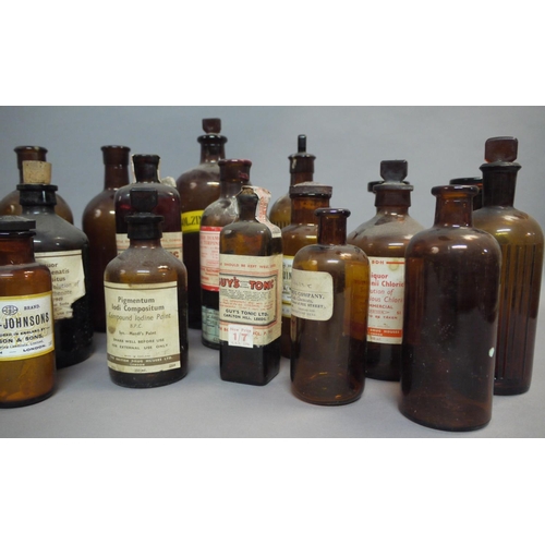 68 - A collection of brown glass pharmacy bottles and jars, including two sealed bottles of Guy's Tonic, ... 