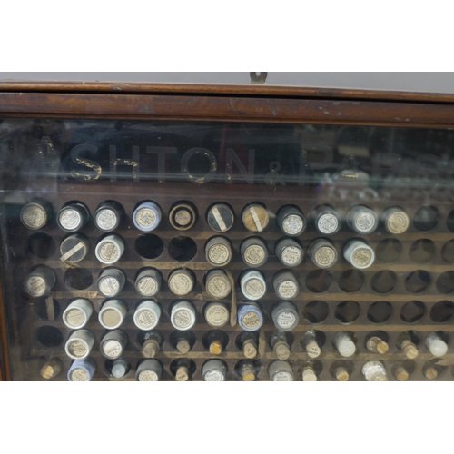 66 - A late 19th/early 20th century mahogany glazed single door wall cabinet, the door lettered in gilt w... 