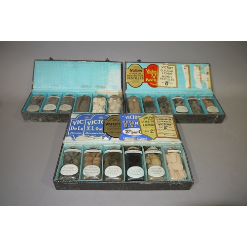 97 - Three early 20th century sample cases each containing six bottles of Victory lozenges, the interior ... 